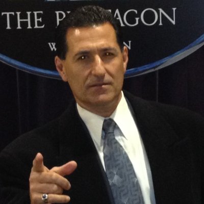 Profile Picture of John Costello (@ExecutiveHood) on Twitter